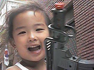 Gun Toting Cutie